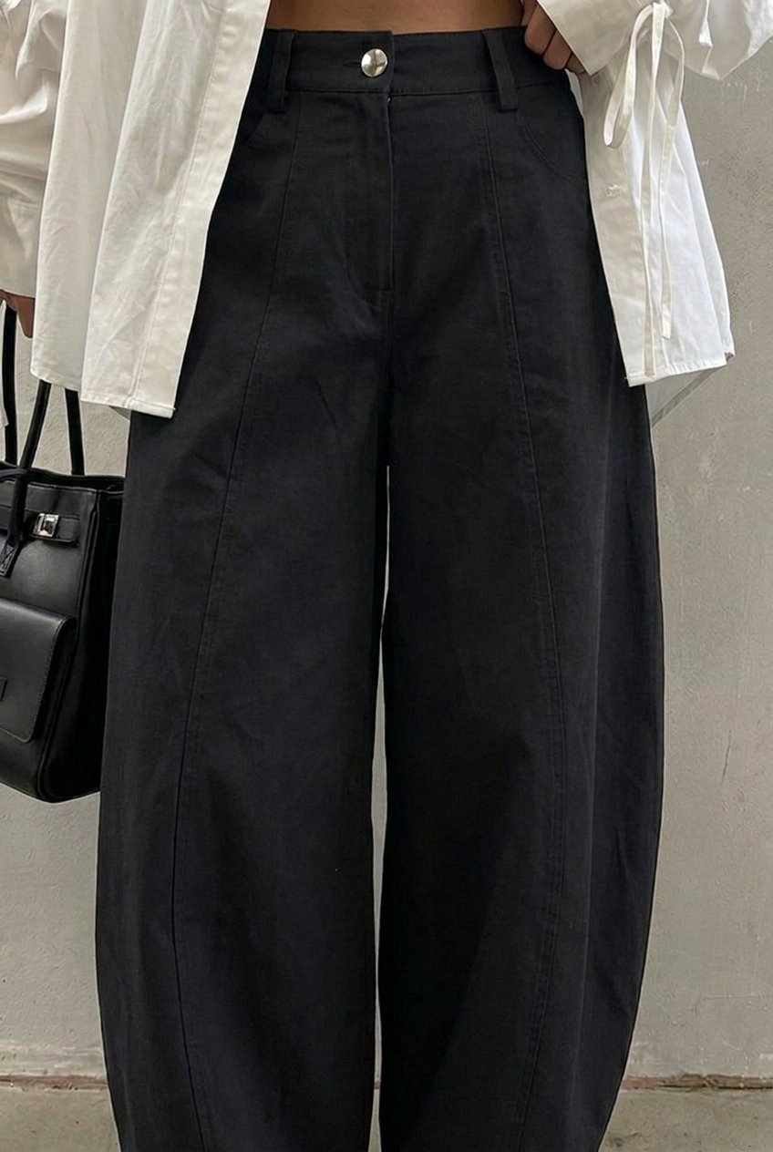 Black Arc Barrel Pants — curved seam detail