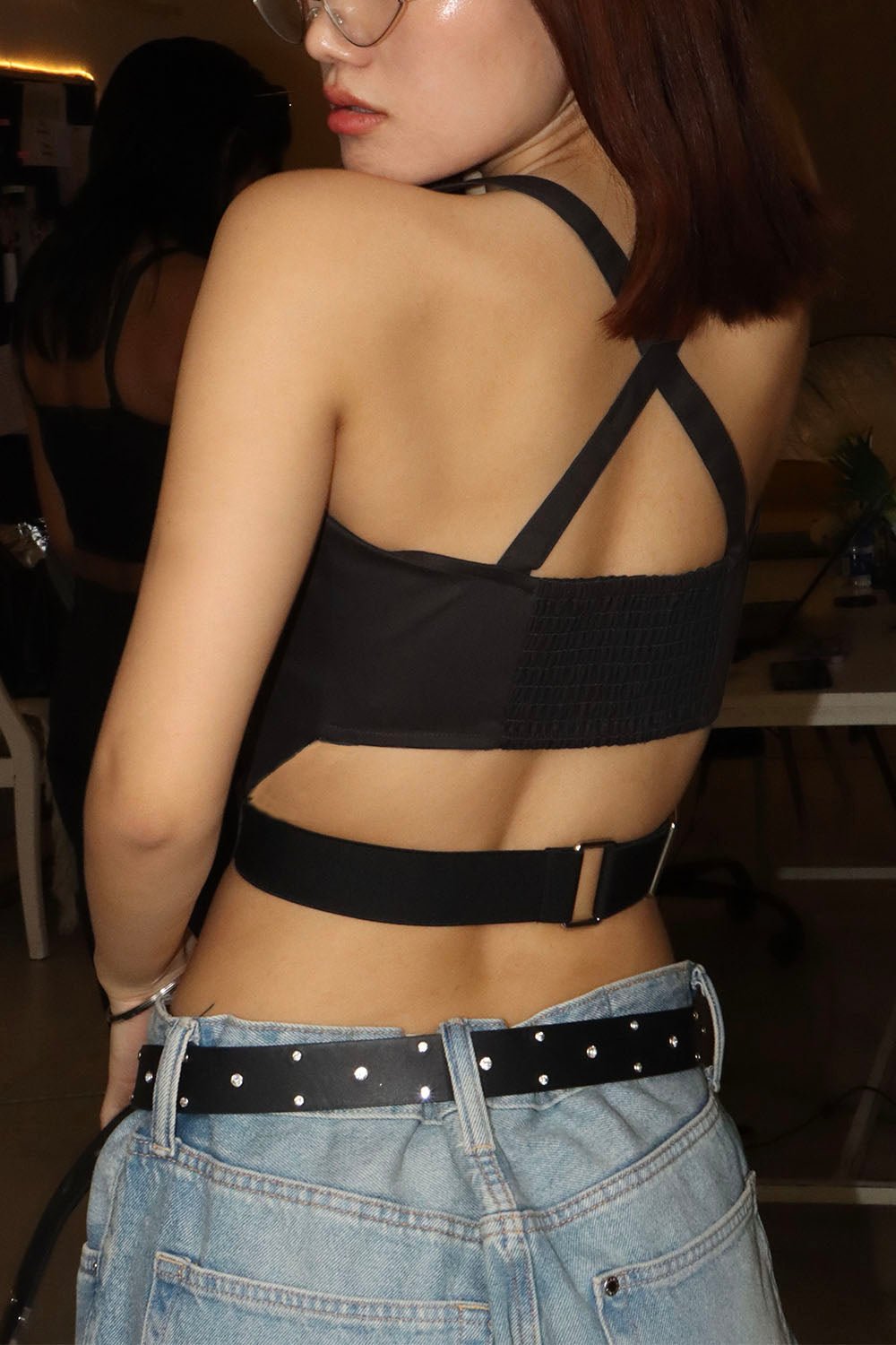 Woman wearing a black CEO zip-up corset in cotton twill – edgy structured design by Beeglee