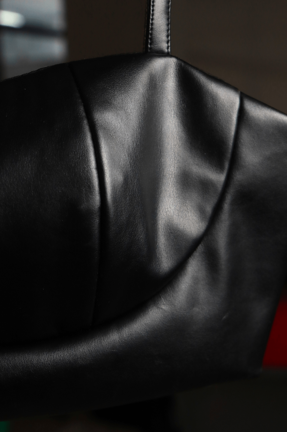 Black leather bralette with spaghetti straps and side zipper