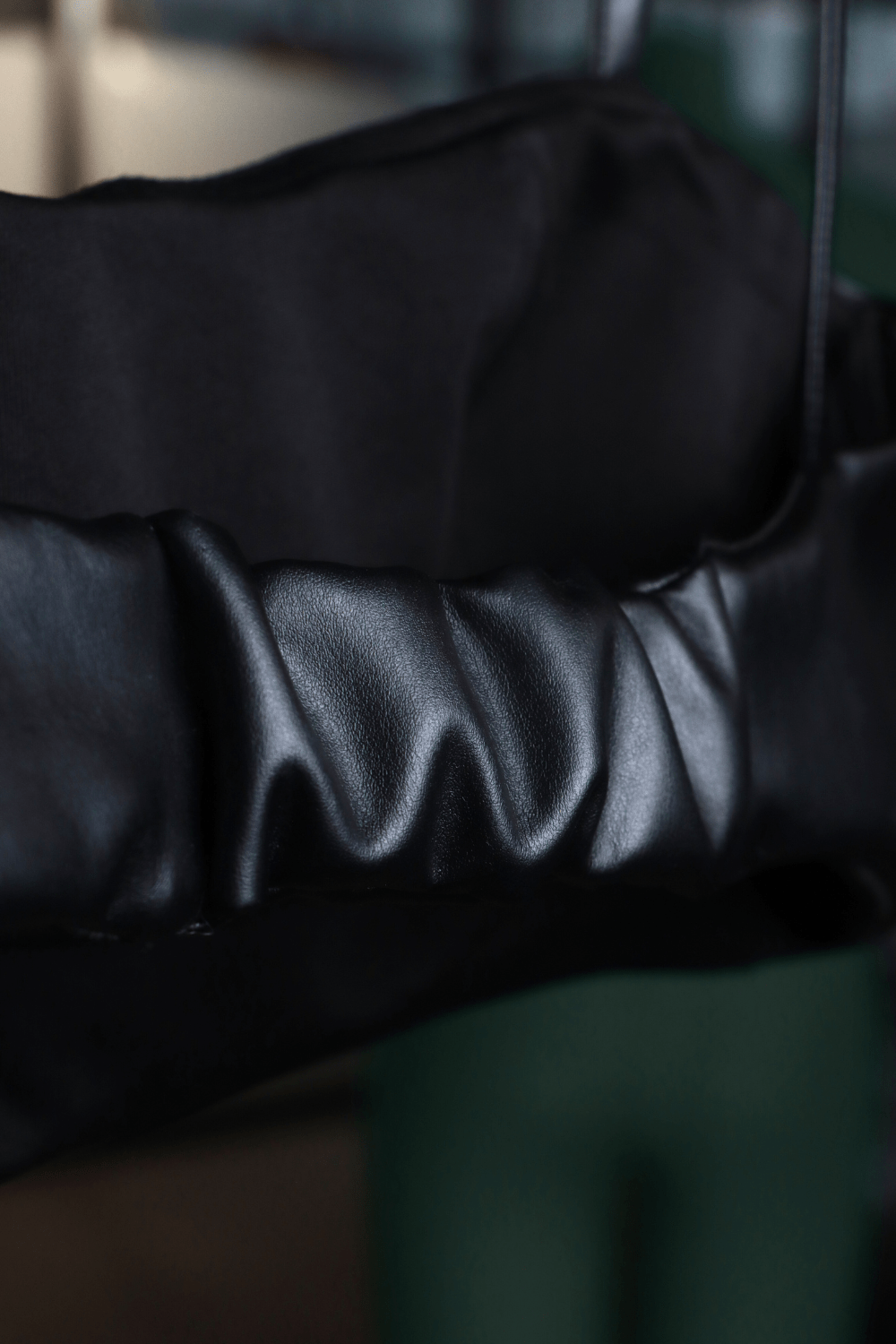 Black leather bralette with spaghetti straps and side zipper