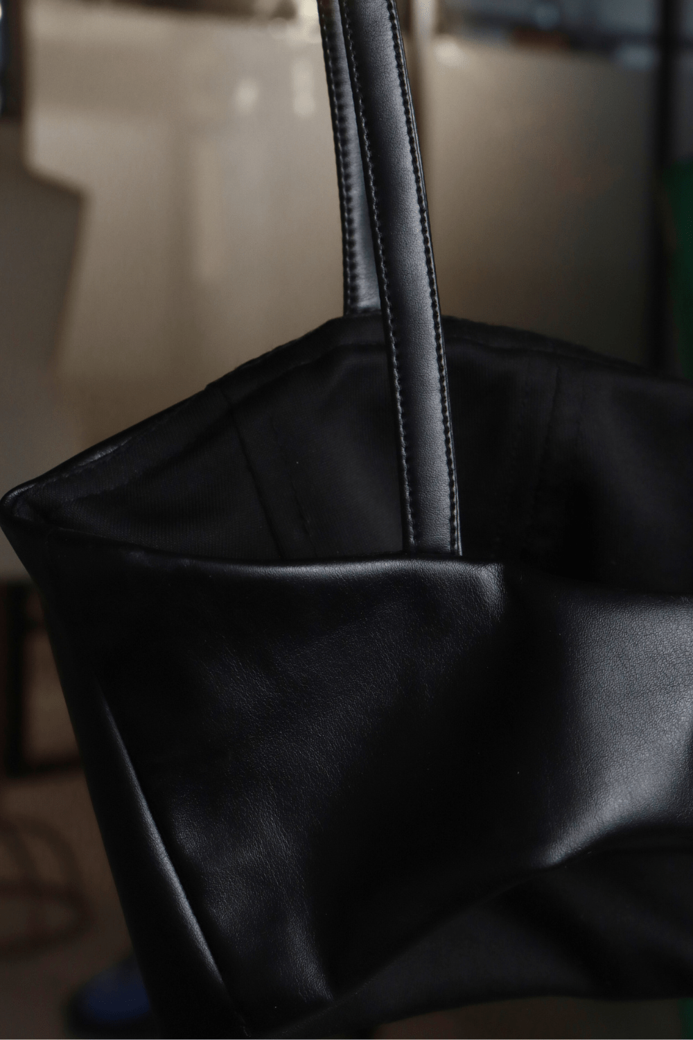 Black leather bralette with spaghetti straps and side zipper