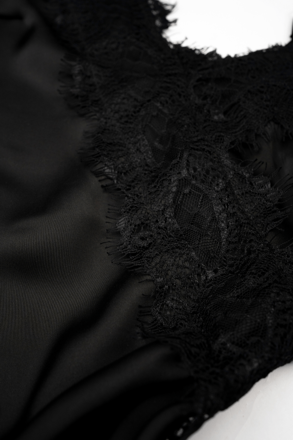 Close-up of black maxi dress fabric smooth, premium finish with elegant detail