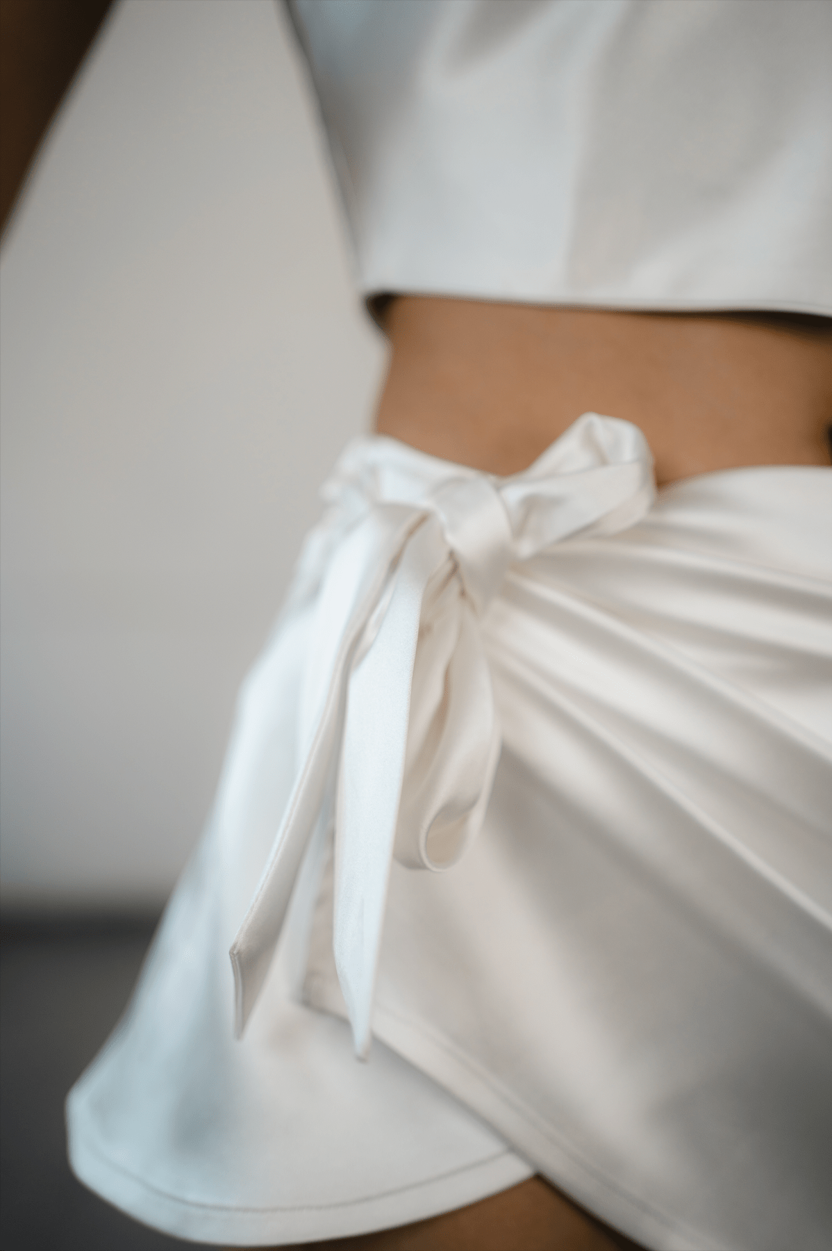 white satin cowl wrap mini skirt with draped front detail