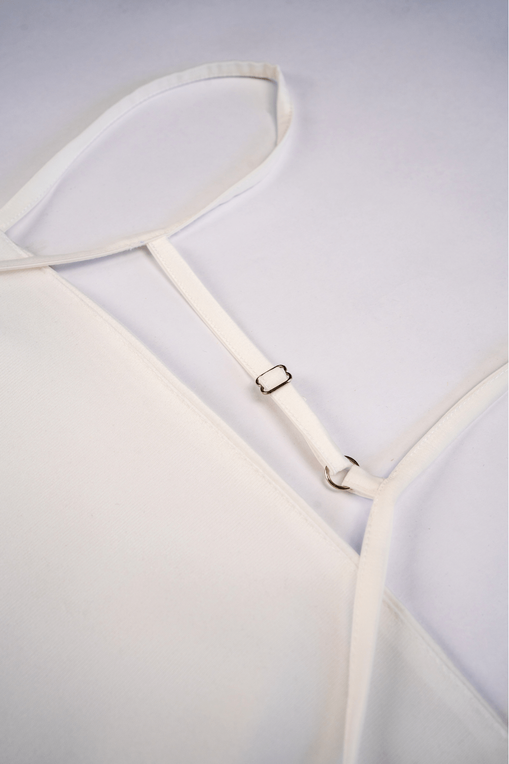 women wearing a sleeveless white satin mini dress – party wear from Beeglee